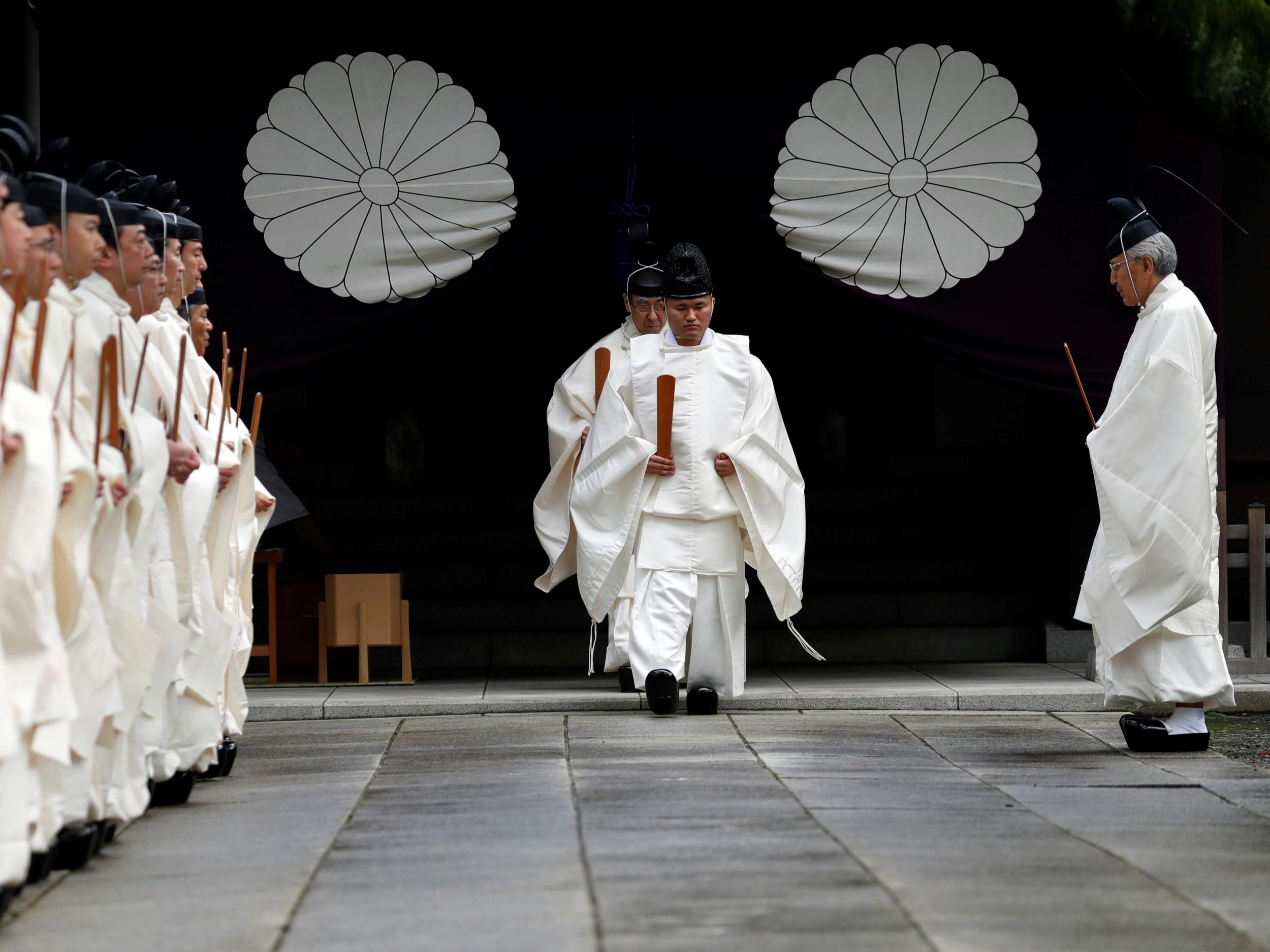 Japanese Shinto priests attend a ritual during an autumn festival at Yasukuni Shrine in Tokyo