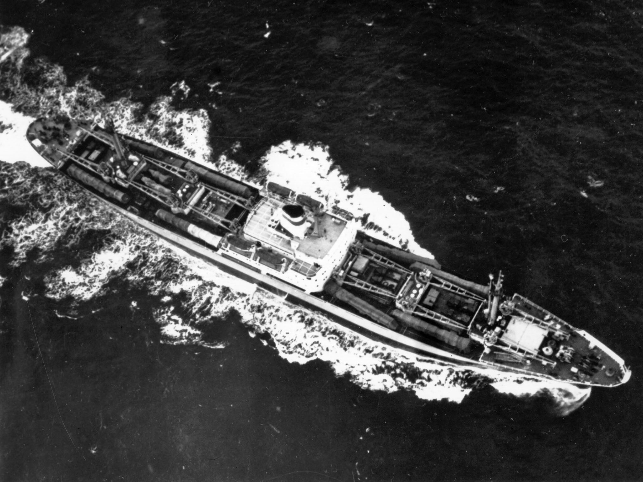 A Soviet cargo ship with eight missile transporters and canvas-covered missiles on deck