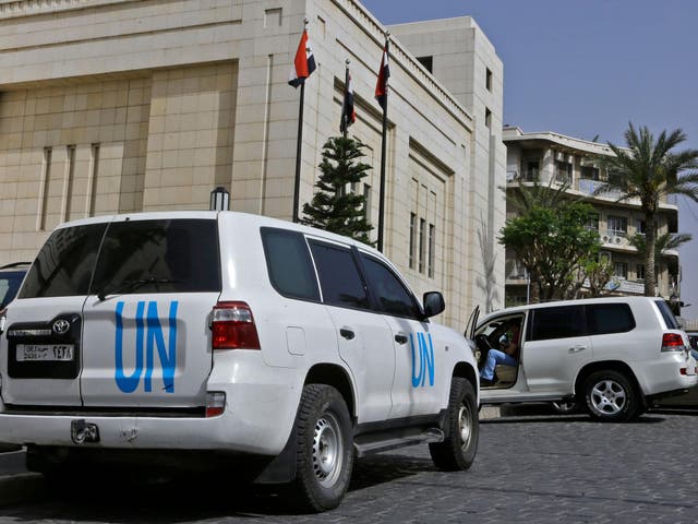 A UN vehicle outside the hotel where international experts from the OPCW are staying in Damascus