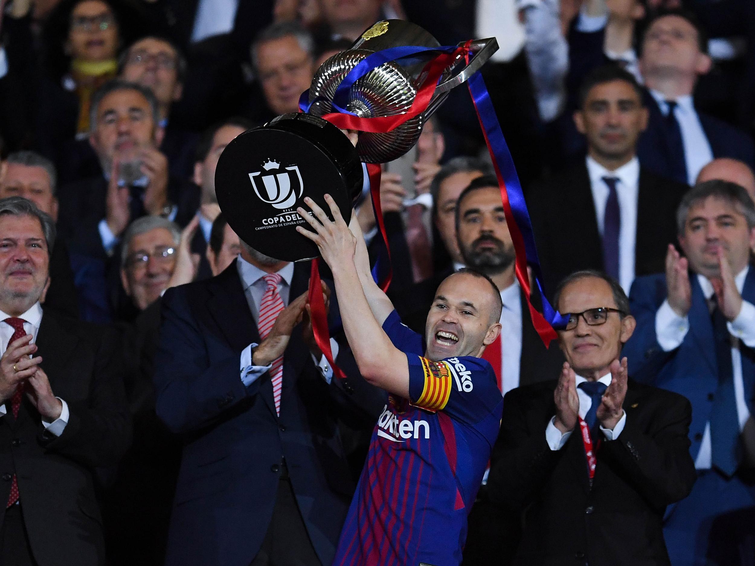 Iniesta lifted the trophy afterwards
