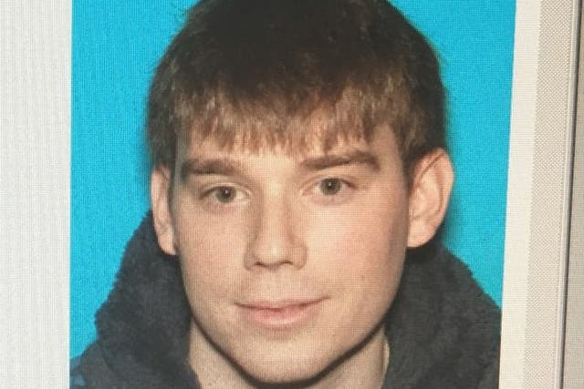 A photo issued by police of Travis Reinking, the suspect who allegedly killed three people