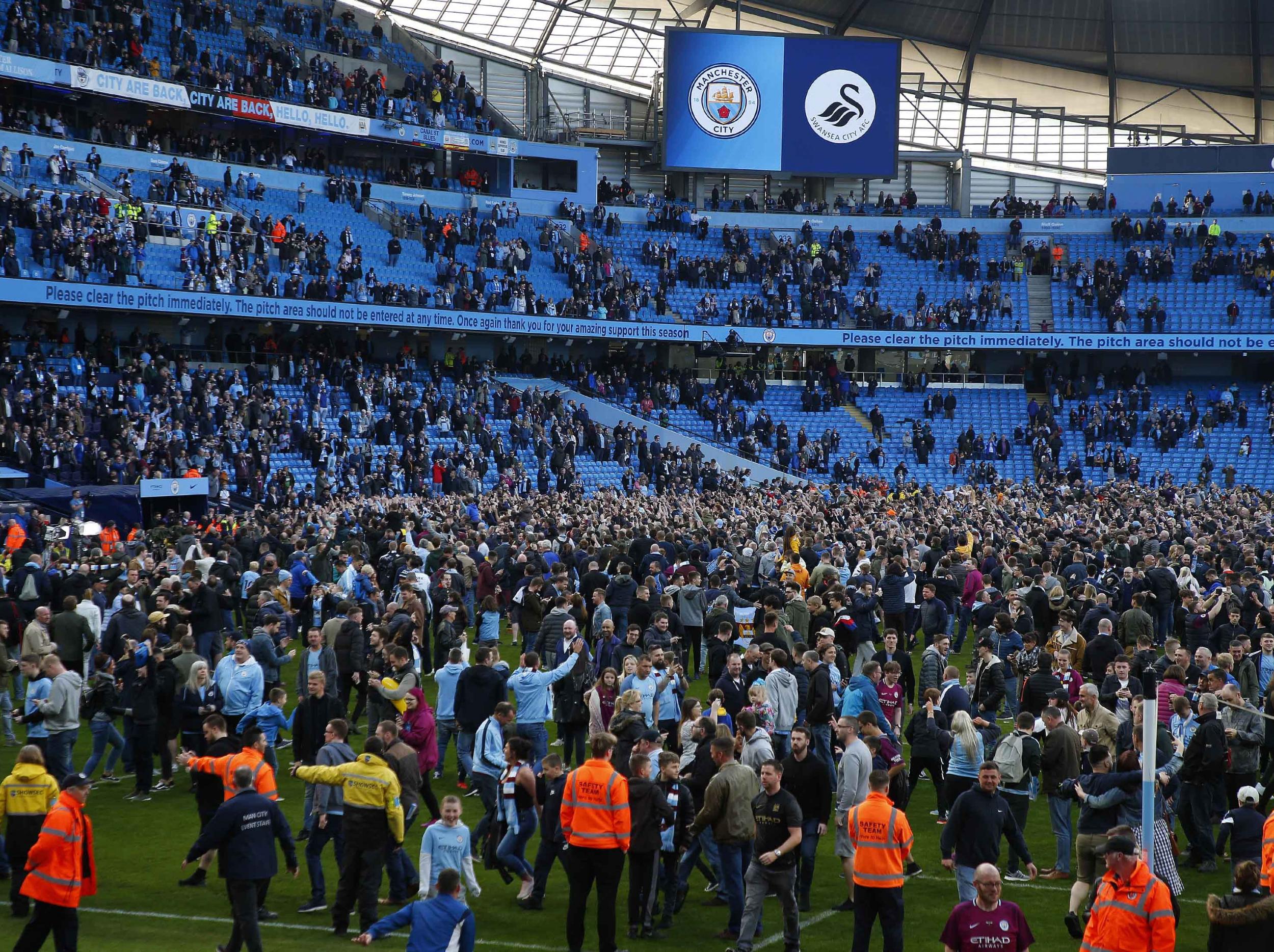 City supporters invaded the pitch after their 5-0 win