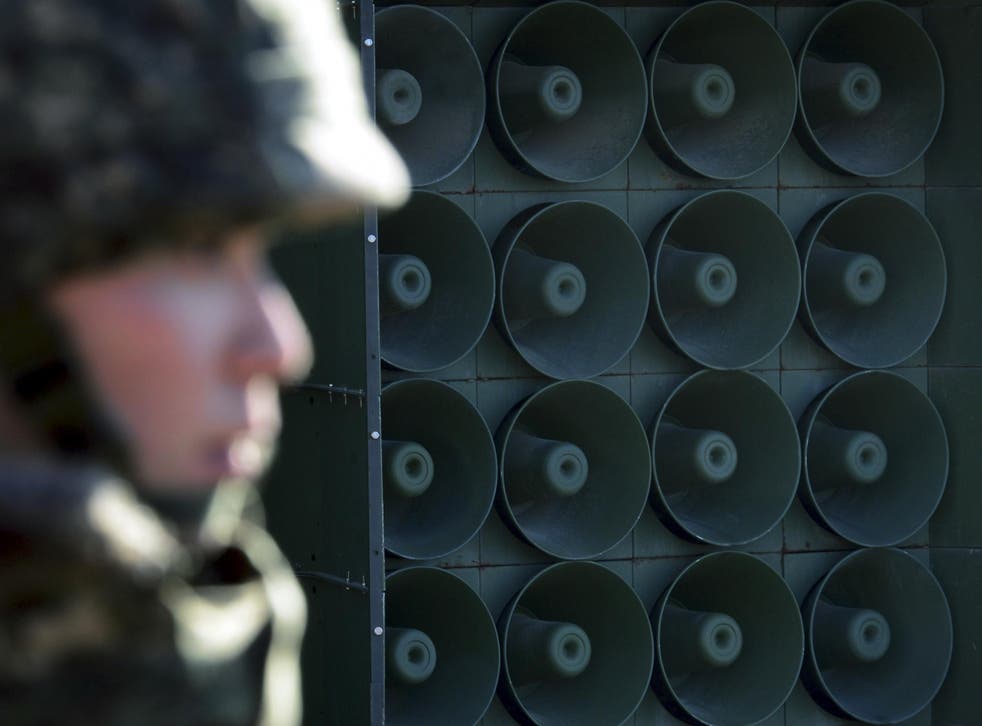A South Korean soldier stands near loudspeakers near the border area with the North