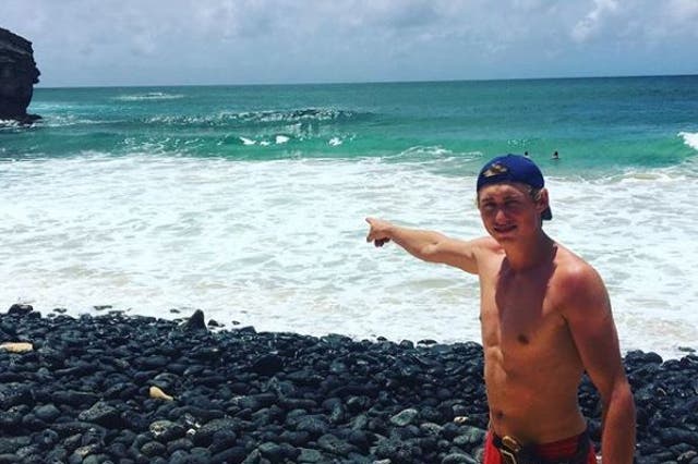 Dylan McWilliams shows where the shark attack happened off the coast of Hawaii