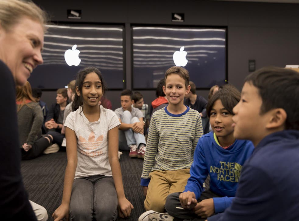 Students meet with one of Apple's team of engineers at its London headquarters