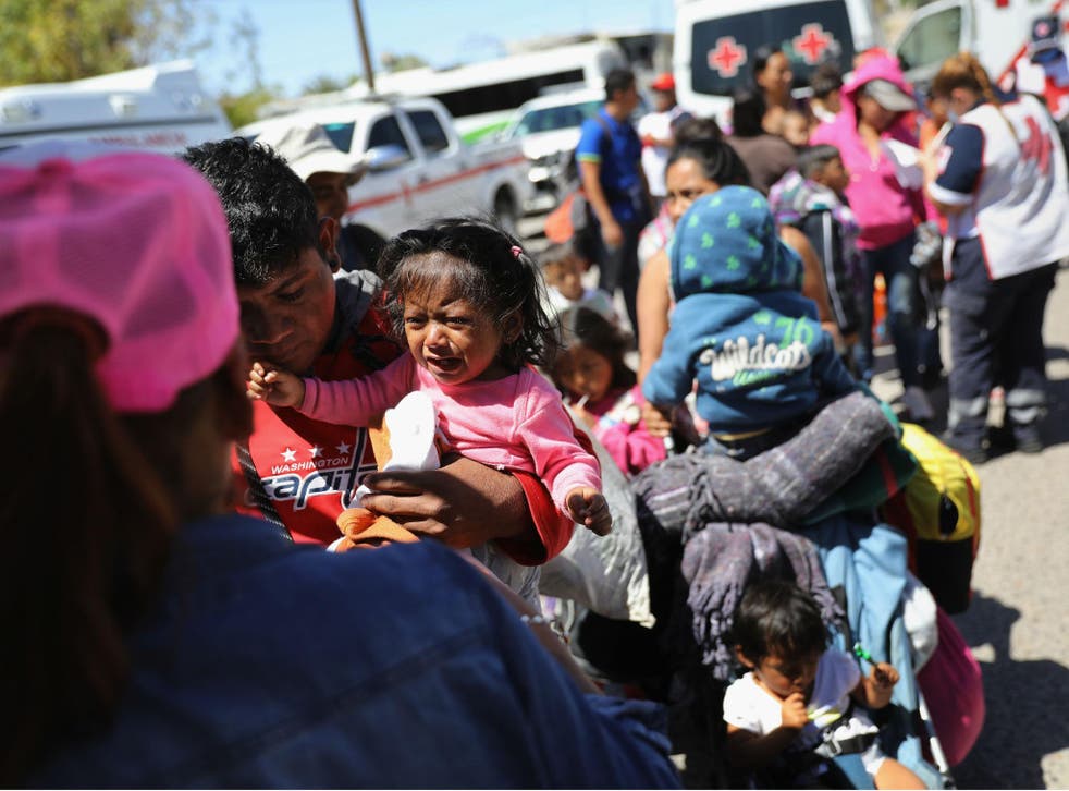 A child in the migrant caravan traveling through Mexico cries
