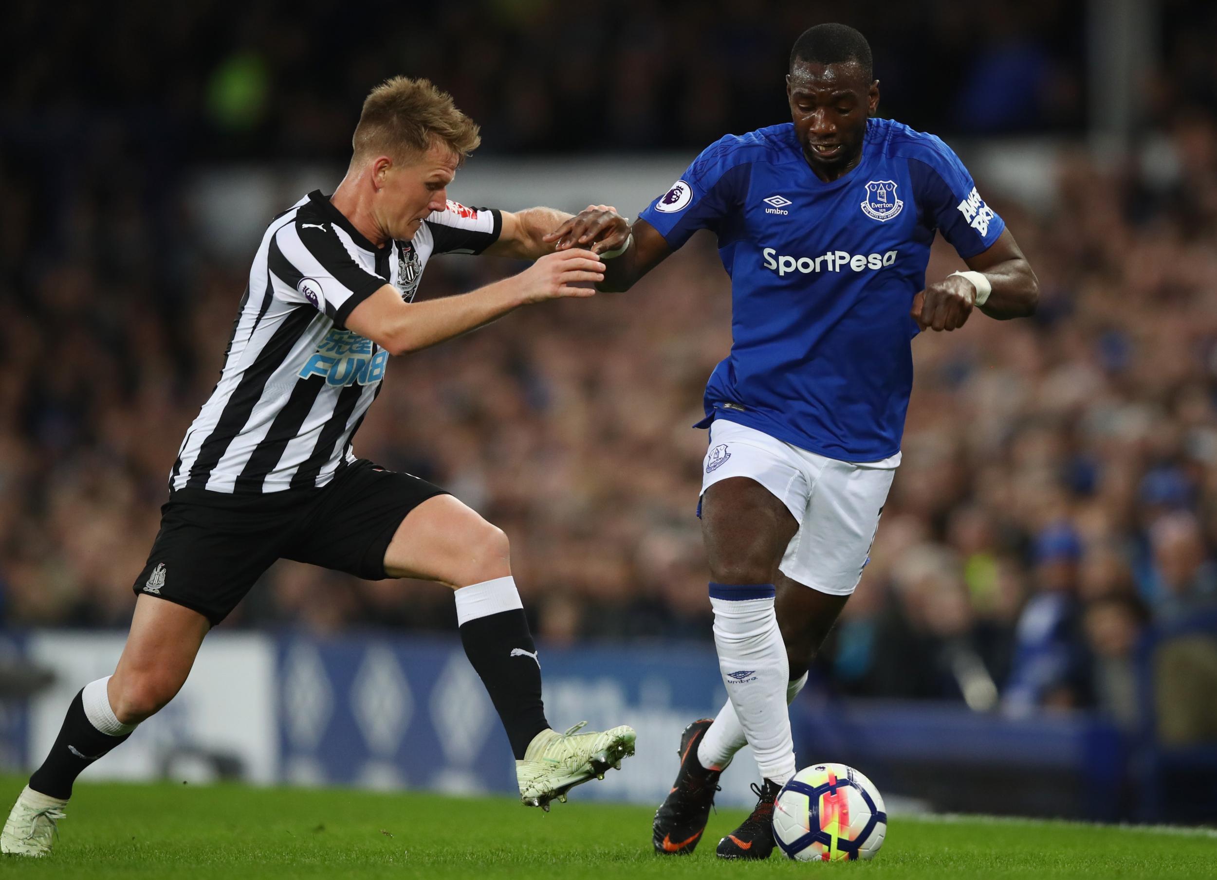 Yannick Bolasie and Matt Ritchie tussle for possession