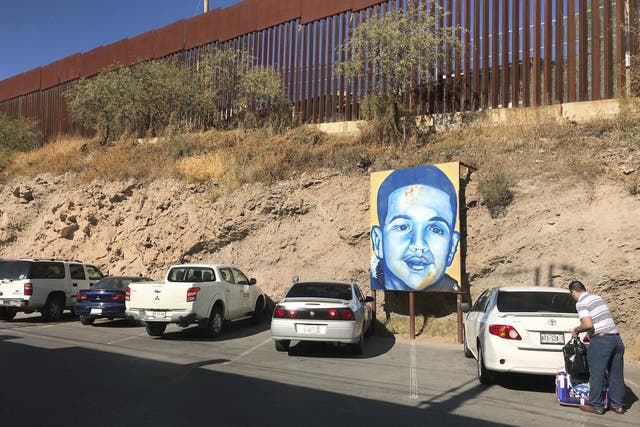 A portrait of 16-year-old Mexican youth Jose Antonio Elena Rodriguez, who was shot and killed in Nogales, Mexico, is displayed on the street where he was killed which runs parallel with the US border