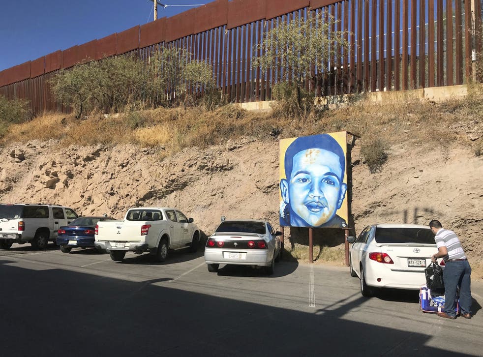 A portrait of 16-year-old Mexican youth Jose Antonio Elena Rodriguez, who was shot and killed in Nogales, Mexico, is displayed on the street where he was killed which runs parallel with the US border