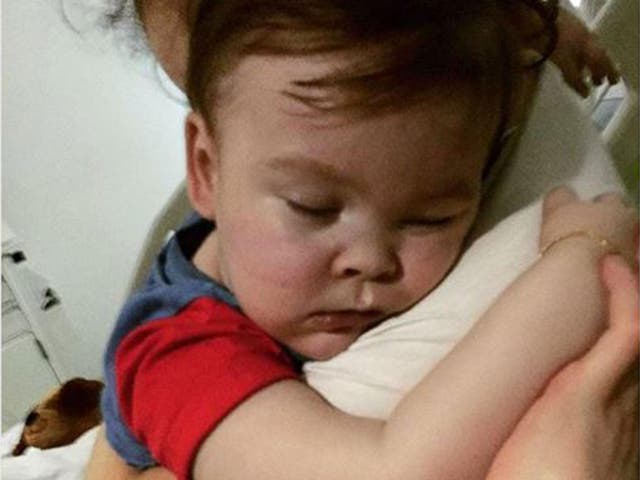 After life-support was withdrawn, the 23-month-old continued breathing and doctors agreed to give him oxygen and water, his father says