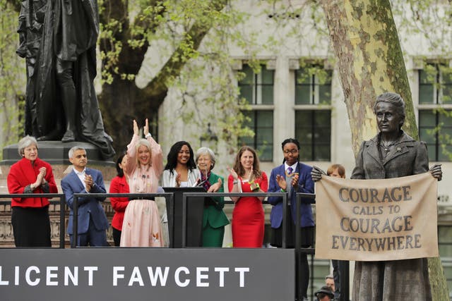 A statue in honour of the first female Suffragette Millicent Fawcett is unveiled as Prime Minister Theresa May and Mayor of London Sadiq Khan look on during a ceremony in Parliament Square. The statue of womens suffrage leader Millicent Fawcett is the first monument of a woman and the first designed by a woman, Turner Prize-winning artist Gillian Wearing OBE, to take a place in parliament Square.