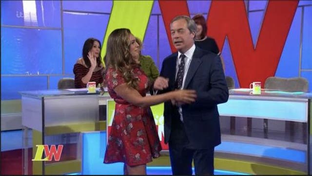 Kelly Brook patiently asked permission to blow a raspberry on Nigel Farage's belly