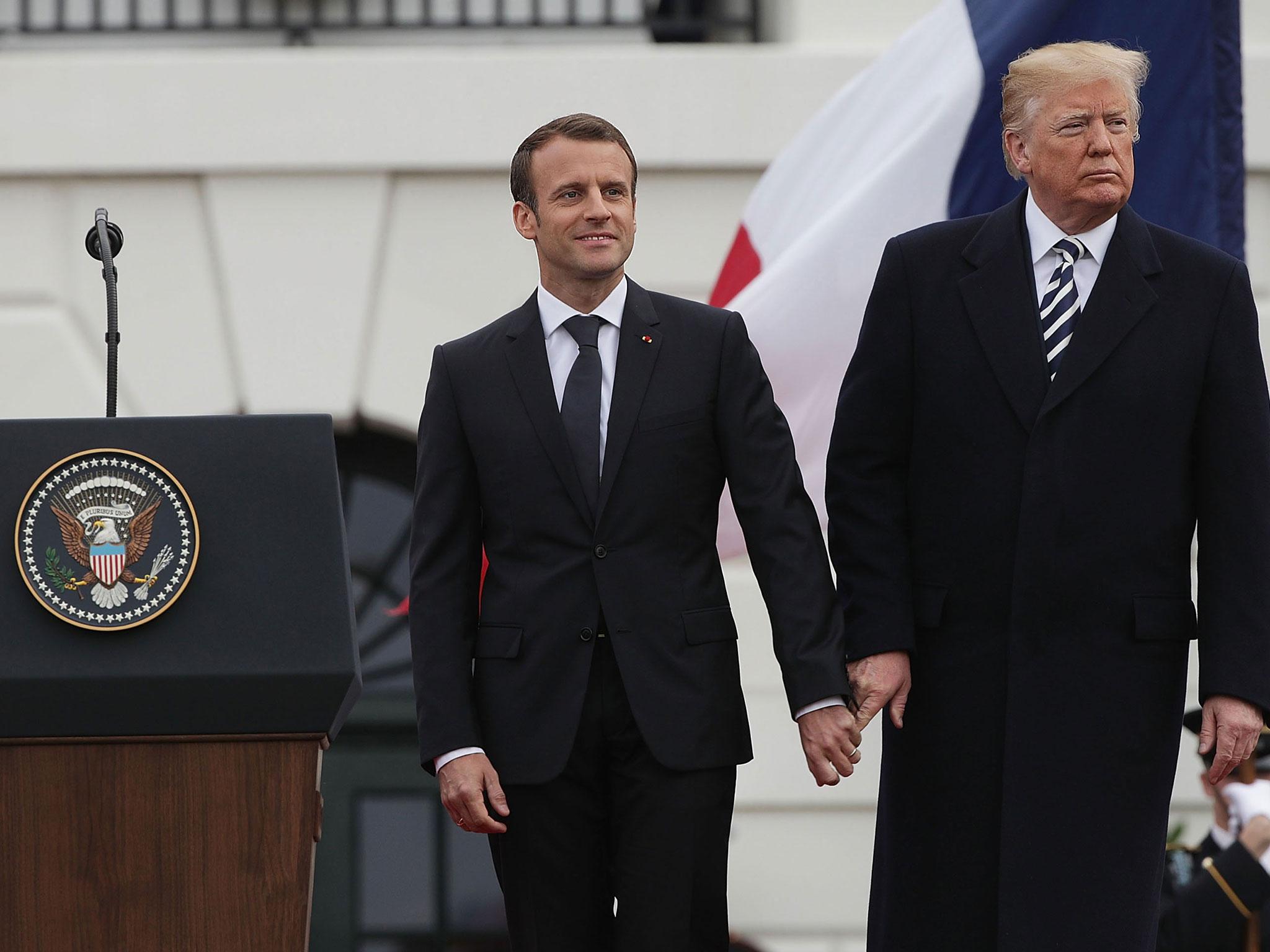 Watch Trump And Macron Awkwardly Touch Each Other In Series Of