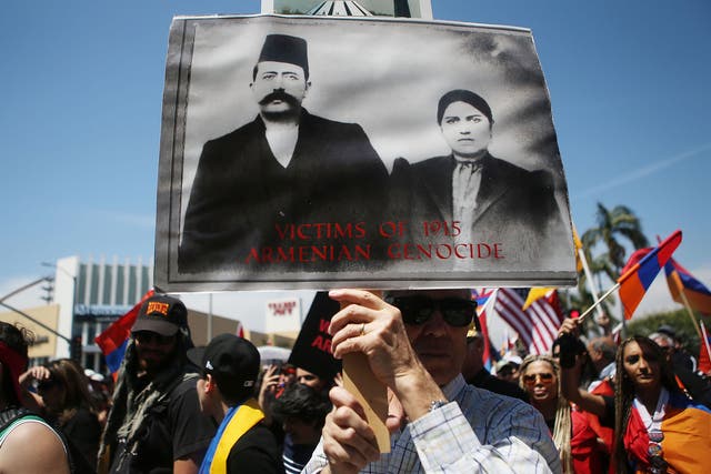 Demonstrators march on the Turkish consulate in Los Angeles during a rally to mark the 103rd anniversary of the Armenian genocide