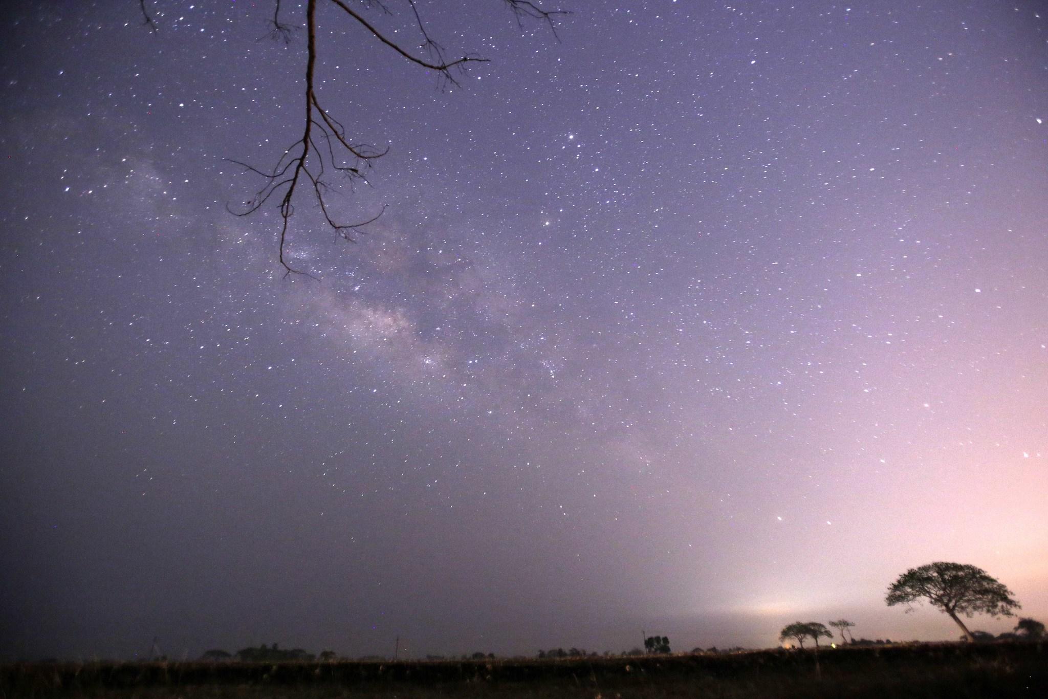 This long-exposure photograph taken on April 23, 2015 on Earth Day shows Lyrids meteors shower passing near the Milky Way in the clear night sky of Thanlyin, nearly 14miles away from Yangon
