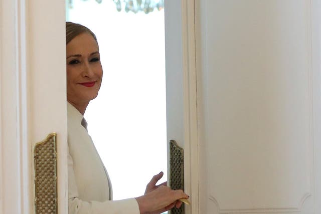 Madrid's regional president Cristina Cifuentes leaves after announcing her resignation