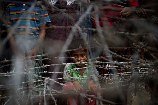 Rohingya refugees gather in the "no man's land" behind Myanmar's boder lined with barb wire fences in Maungdaw district, Rakhine state bounded by Bangladesh. Myanmar government said on April 15, it repatriated on April 14 the first family of Rohingya out of some 700,000 refugees who have fled a brutal military campaign, a move slammed by a rights group as a PR stunt ignoring UN warnings that a safe return is not yet possible.