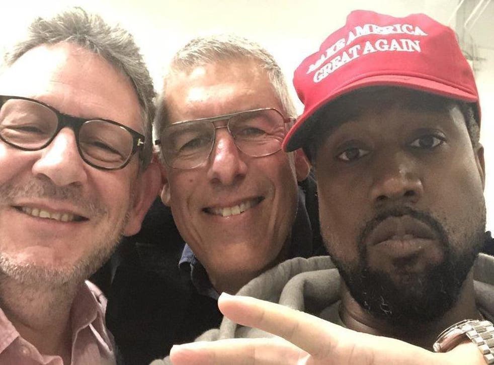 Kanye West alongside two unknown men (Twitter)