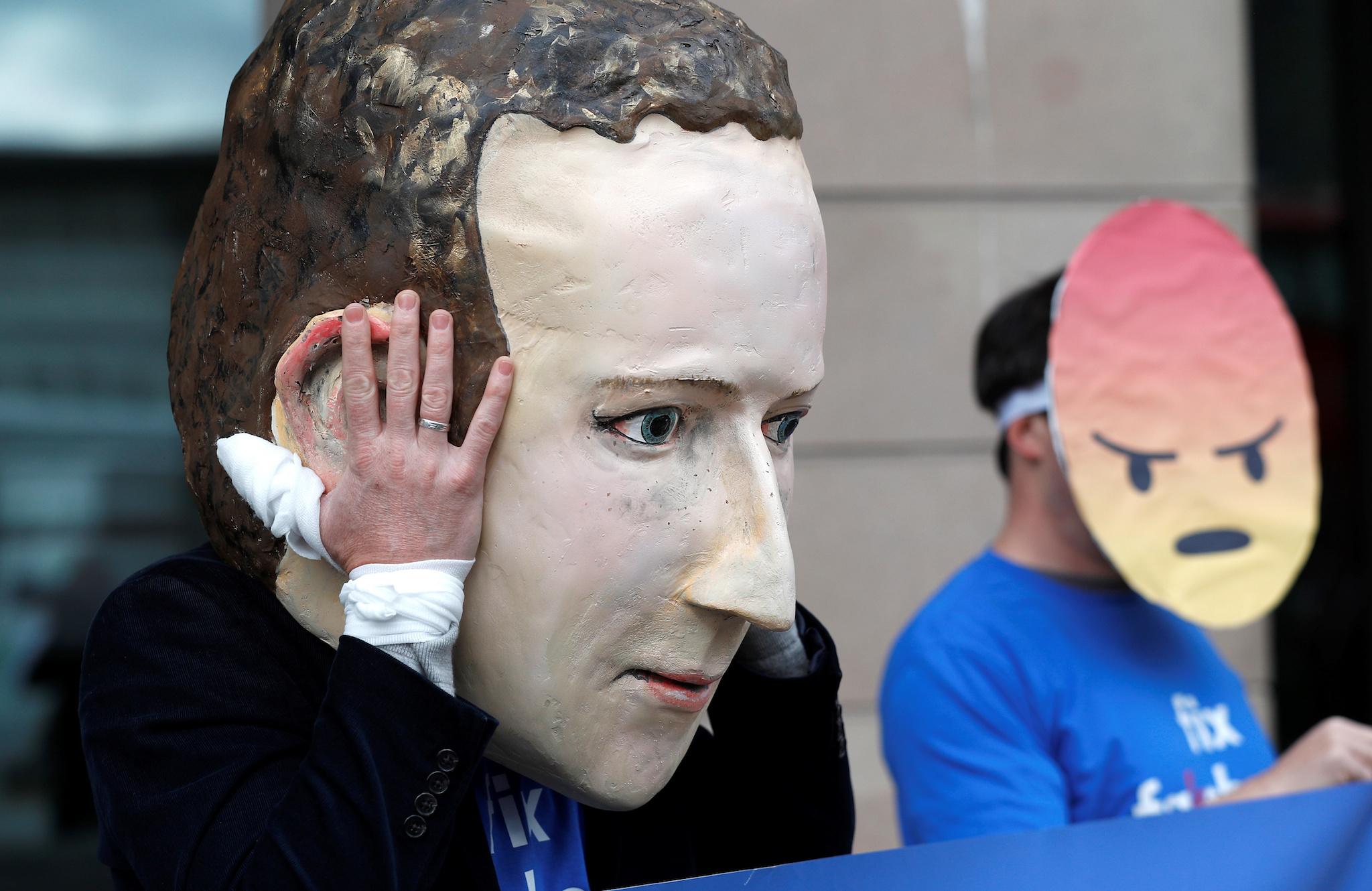 Protesters from the pressure group Avaaz demonstrate against Facebook outside Portcullis House in Westminster