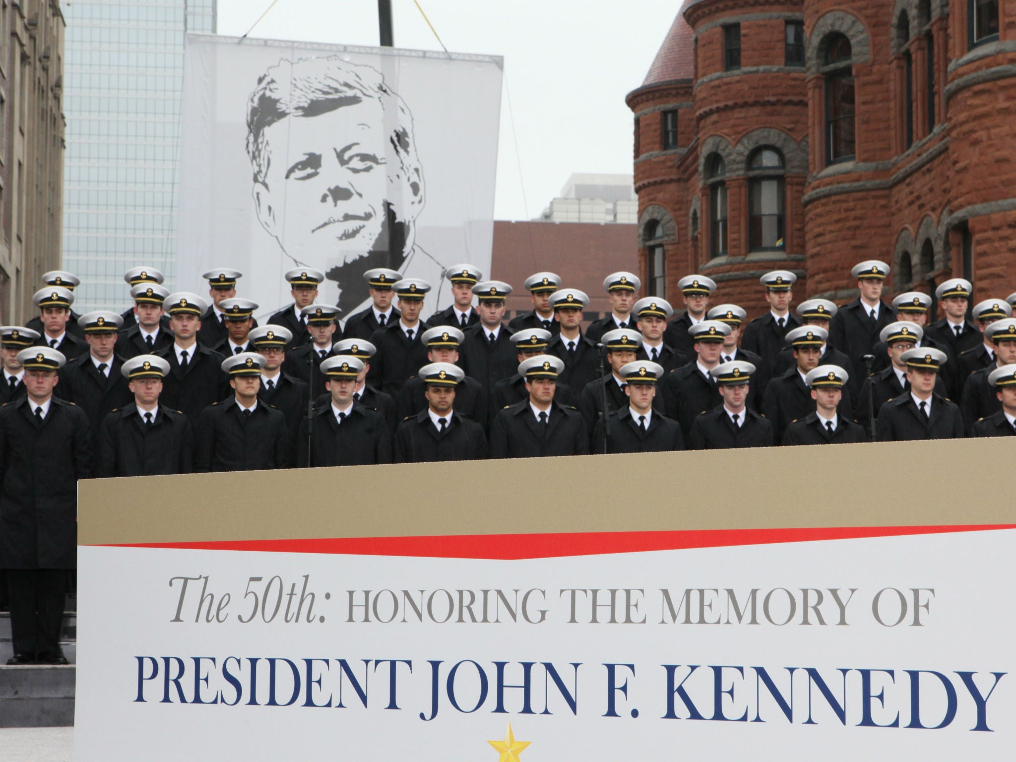 Members of the US Naval Academy mark the anniversary of John F Kennedy's assassination in Dallas, Texas