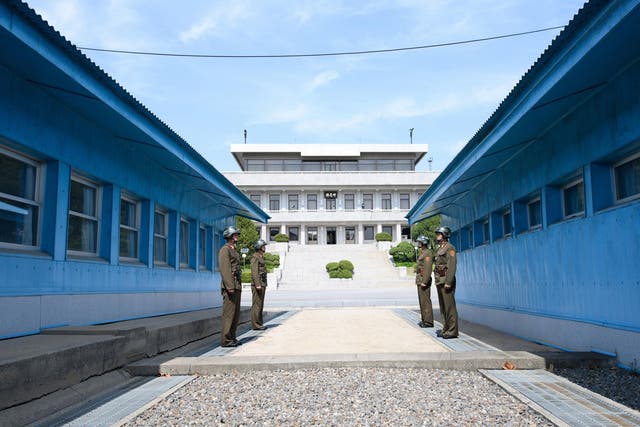 North Korean soldiers stand guard at the Joint Security Area (JSA) of the Demilitarised Zone in the border village of Panmunjom in Paju, South Korea