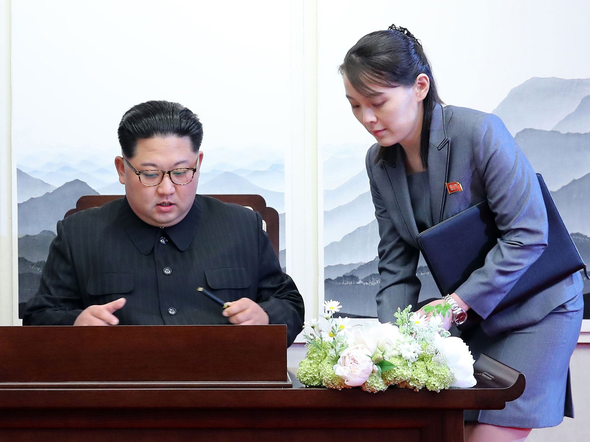 Kim Yo-jong handed her brother a pen so he could sign the guest book at the Peace House building on the southern side of the truce village of Punmunjom