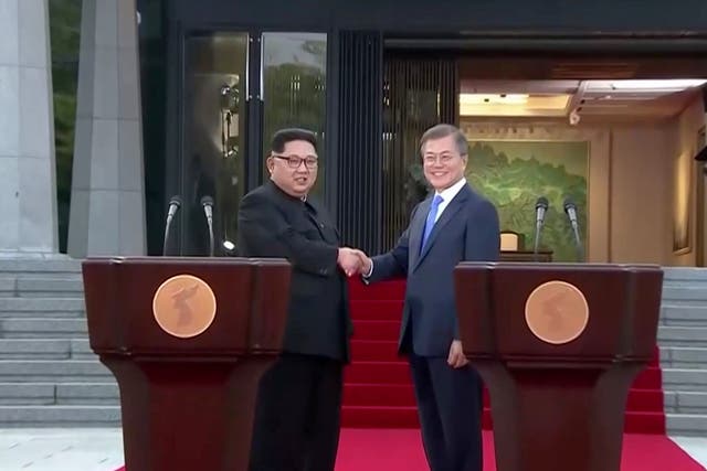 outh Korean President Moon Jae-in and North Korean leader Kim Jong Un shake hands after delivering a joint statement
