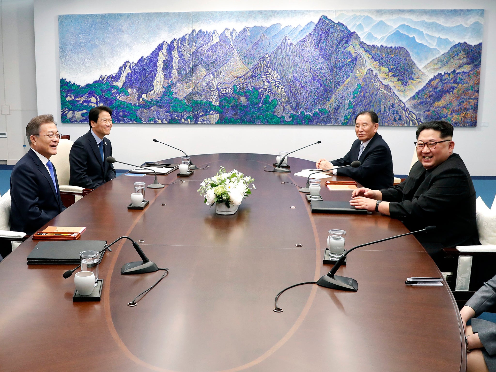 South Korean President Moon Jae-In and North Korean leader Kim Jong-U talk during their summit meeting at the Peace House