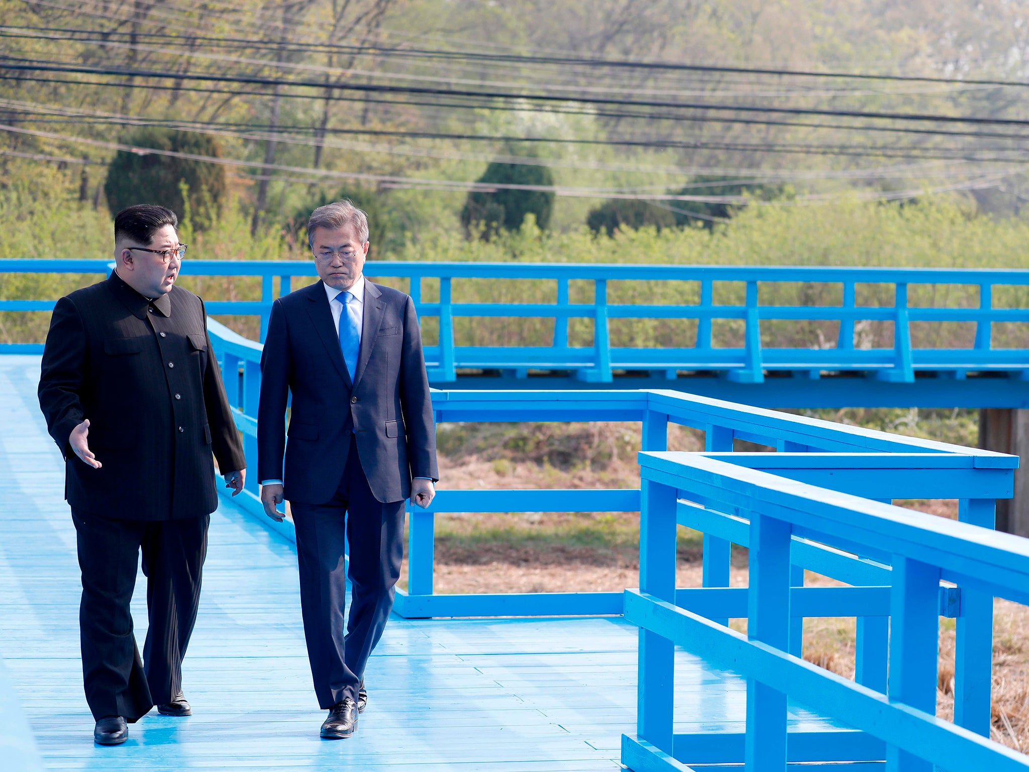 Wang Yi's planned visit will build on a previous trip by Kim Jong-un, left, to Beijing, and follows last Friday's inter-Korean summit