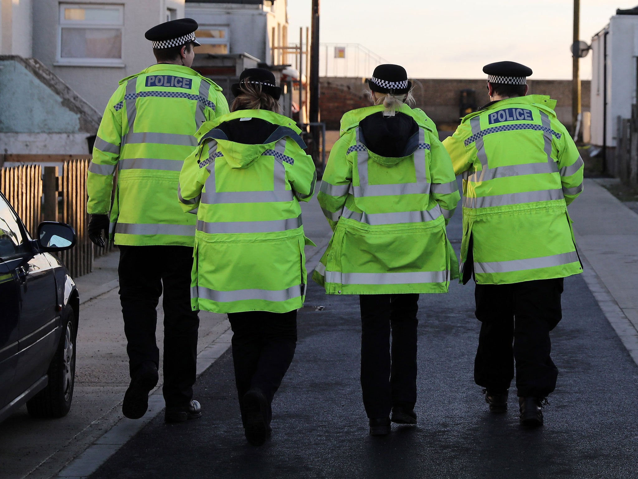 Police officers patrol as residents begin to prepare for a storm surge that could affect their properties on January 13, 2017 in Jaywick, England.