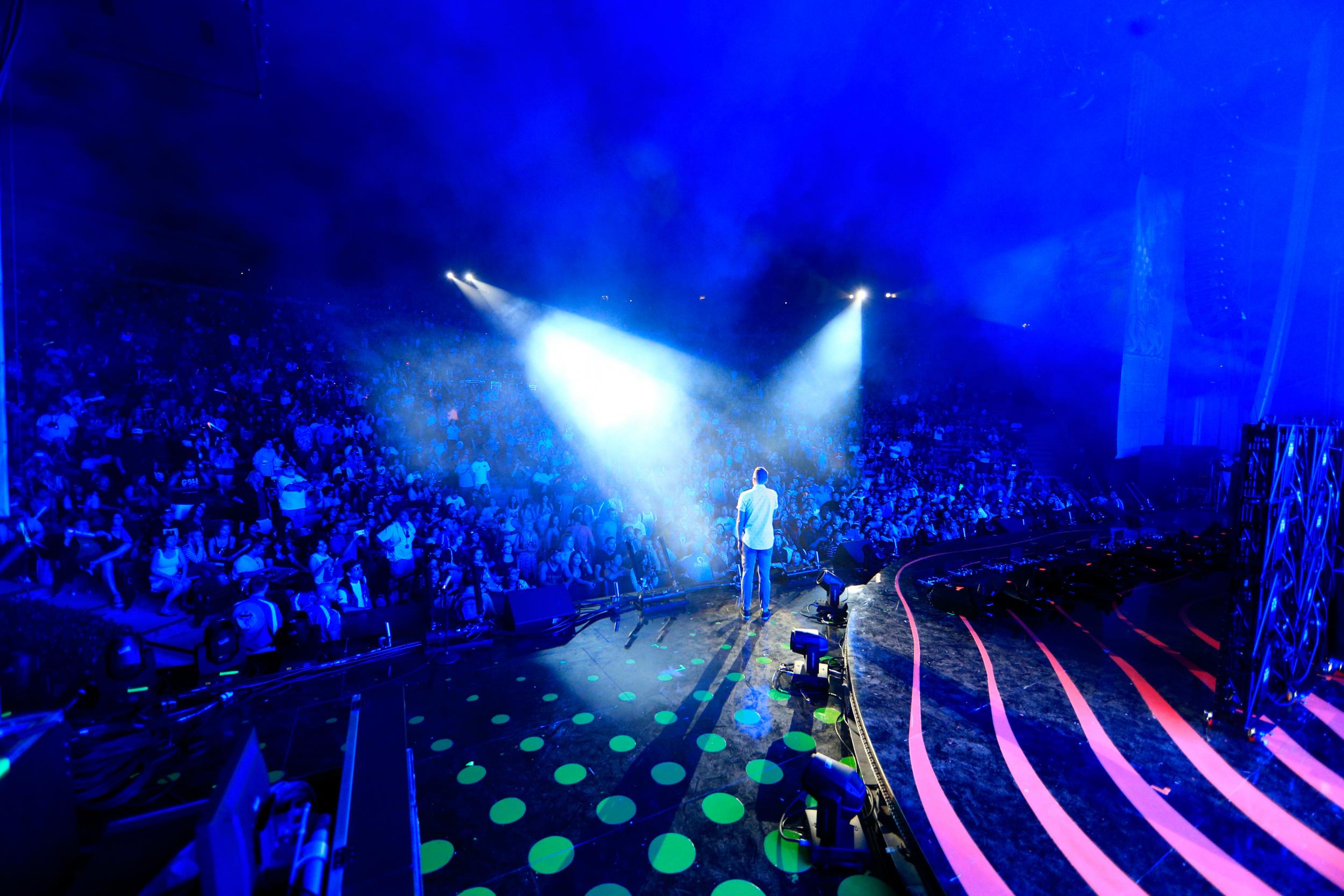 Avicii onstage at Verizon Wireless Music Centre in Irvine, California, in May 2014