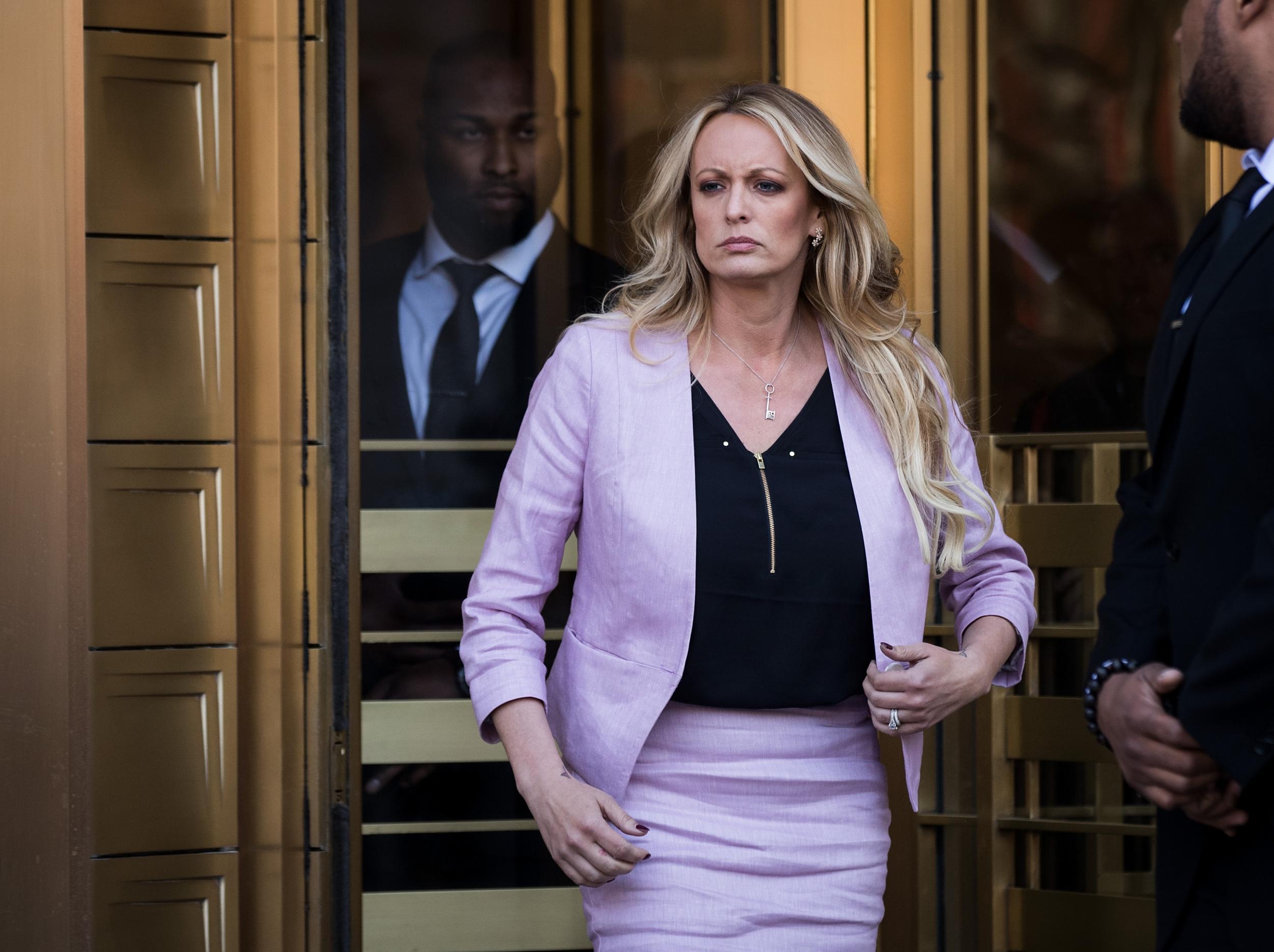 Adult film star Stormy Daniels enters stage left