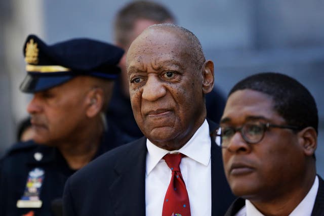 <p>Bill Cosby, center, leaves the the Montgomery County Courthouse after being convicted of drugging and molesting a woman</p>