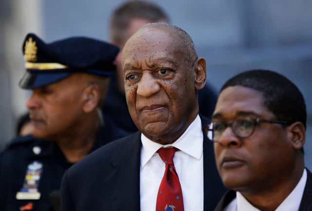 <p>Bill Cosby, center, leaves the the Montgomery County Courthouse after being convicted of drugging and molesting a woman</p>