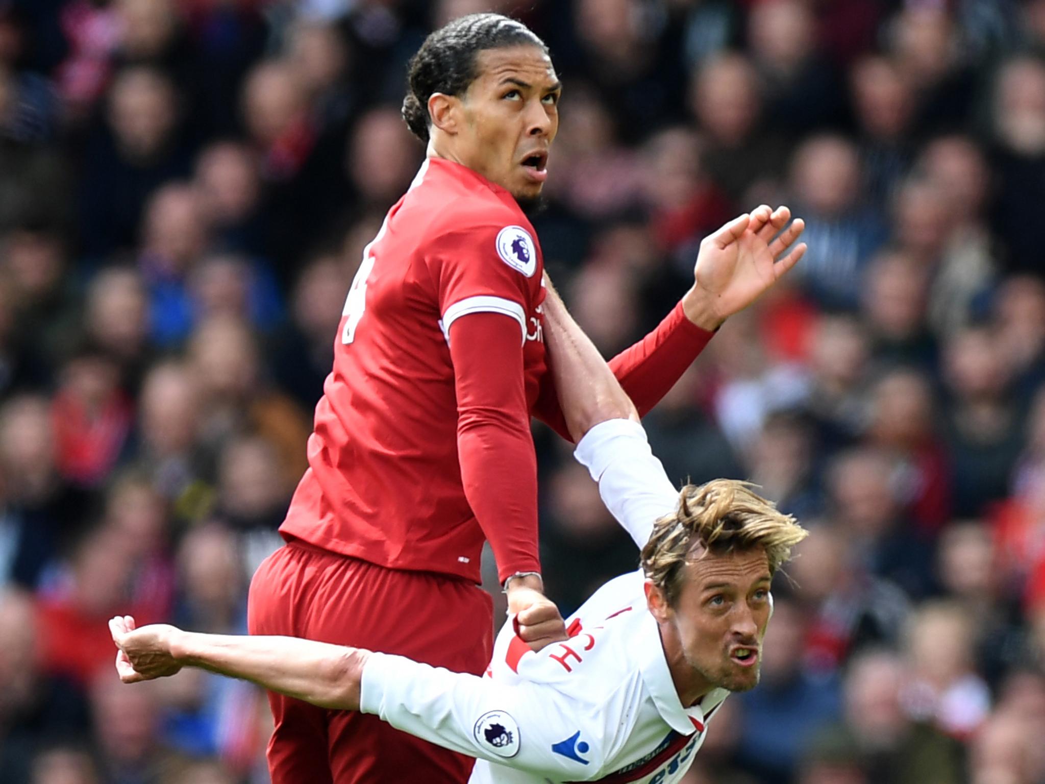 Virgil van Dijk competes with Peter Crouch