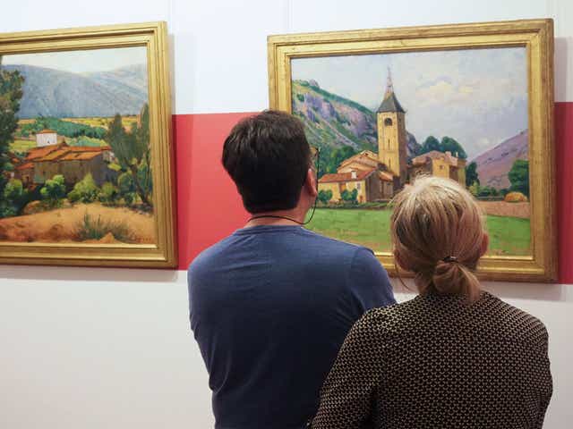 Visitors look at paintings by Etienne Terrus at the reopening of the Terrus Museum in Elne