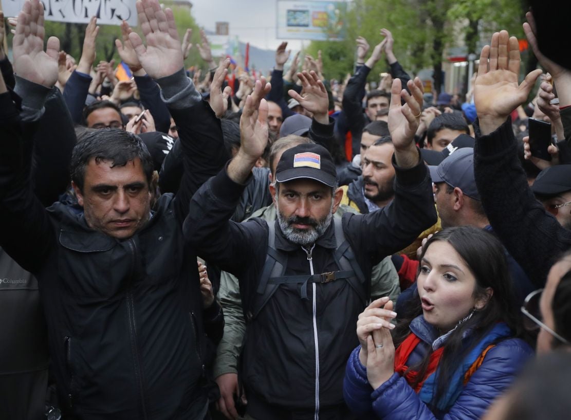 Opposition leader Nikol Pashinian, centre, with a crowd after an opposition rally in the town of Vanadzor, Armenia