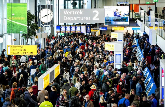 Passengers in the departure hall of Schiphol Airport on the outskirts of Amsterdam, after a number of flights were cancelled due to a power outage