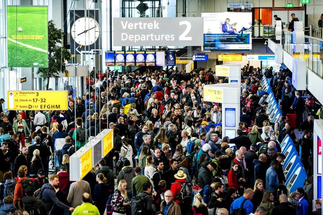 Passengers in the departure hall of Schiphol Airport on the outskirts of Amsterdam, after a number of flights were cancelled due to a power outage