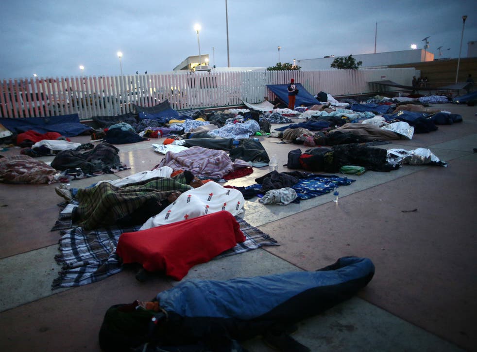 Central America migrants sleep near the San Ysidro checkpoint, in Tijuana, Mexico