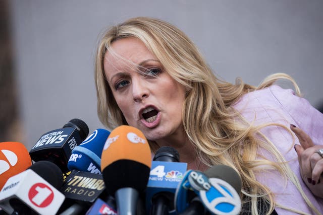 Stormy Daniels speaks to reporters as she exits the United States District Court Southern District of New York