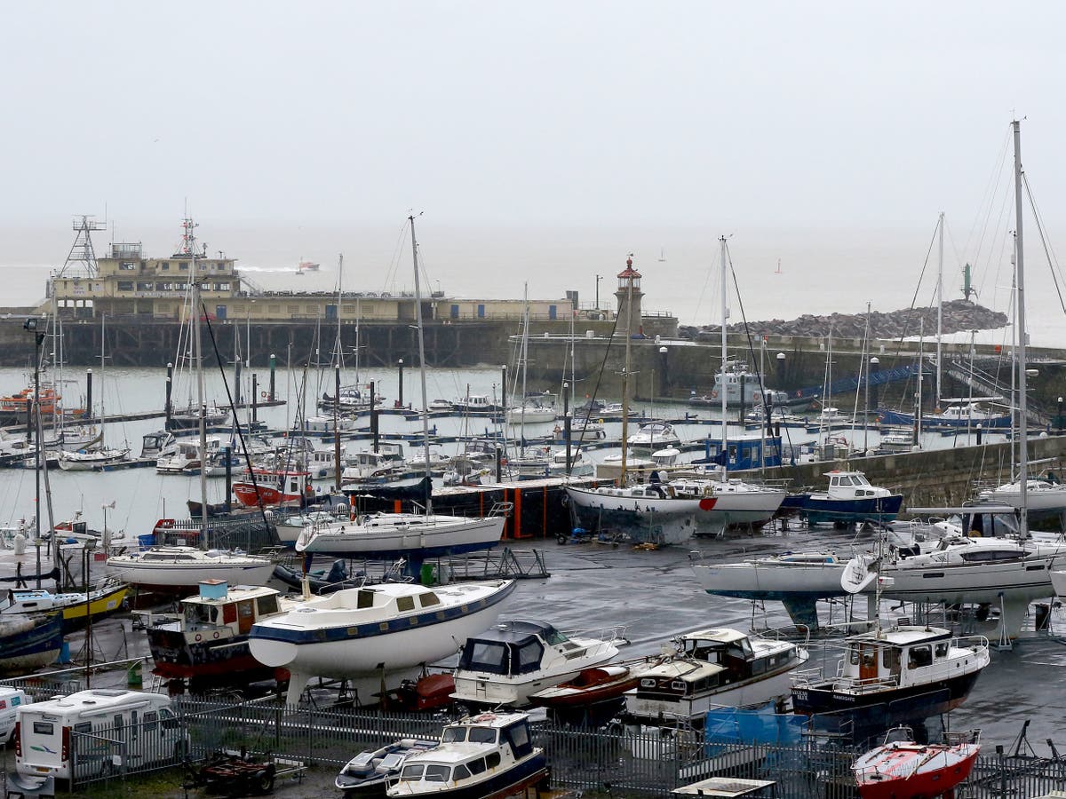 UK weather Man dies after being swept into harbour as heavy rain and