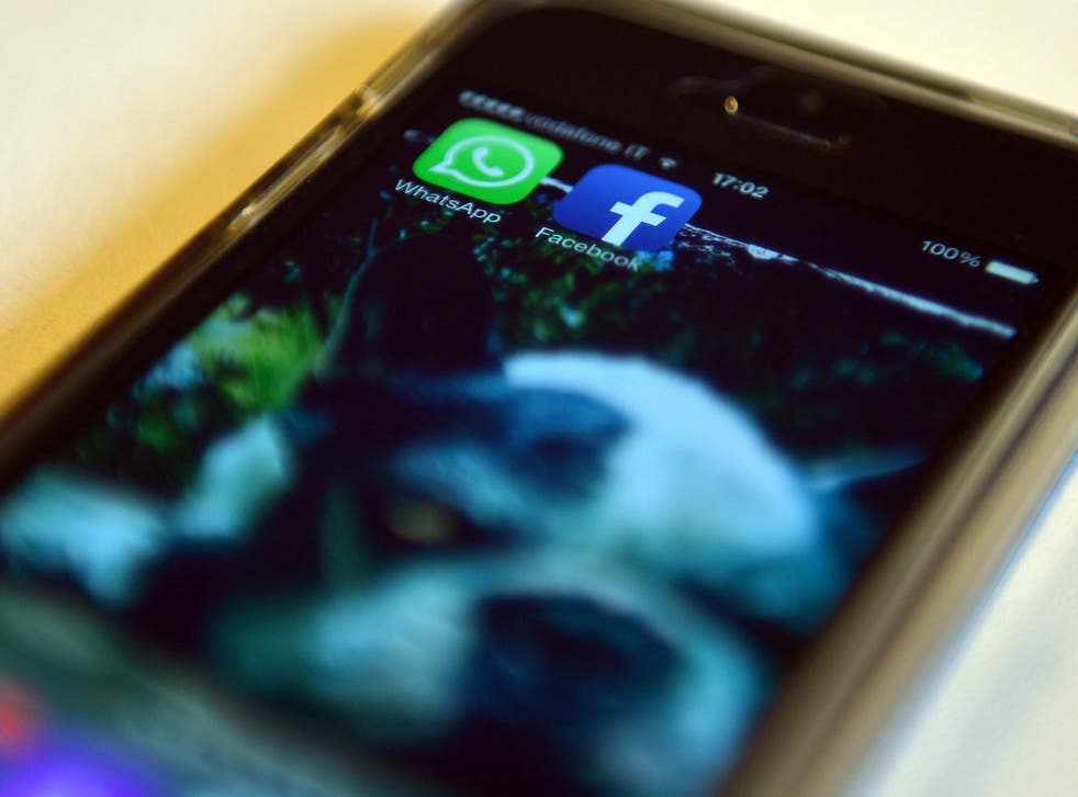 The Facebook and WhatsApp applications' icons are displayed on a smartphone on February 20, 2014 in Rome