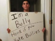 Father makes teenager stand on busy street with ‘I’m a bully’ sign