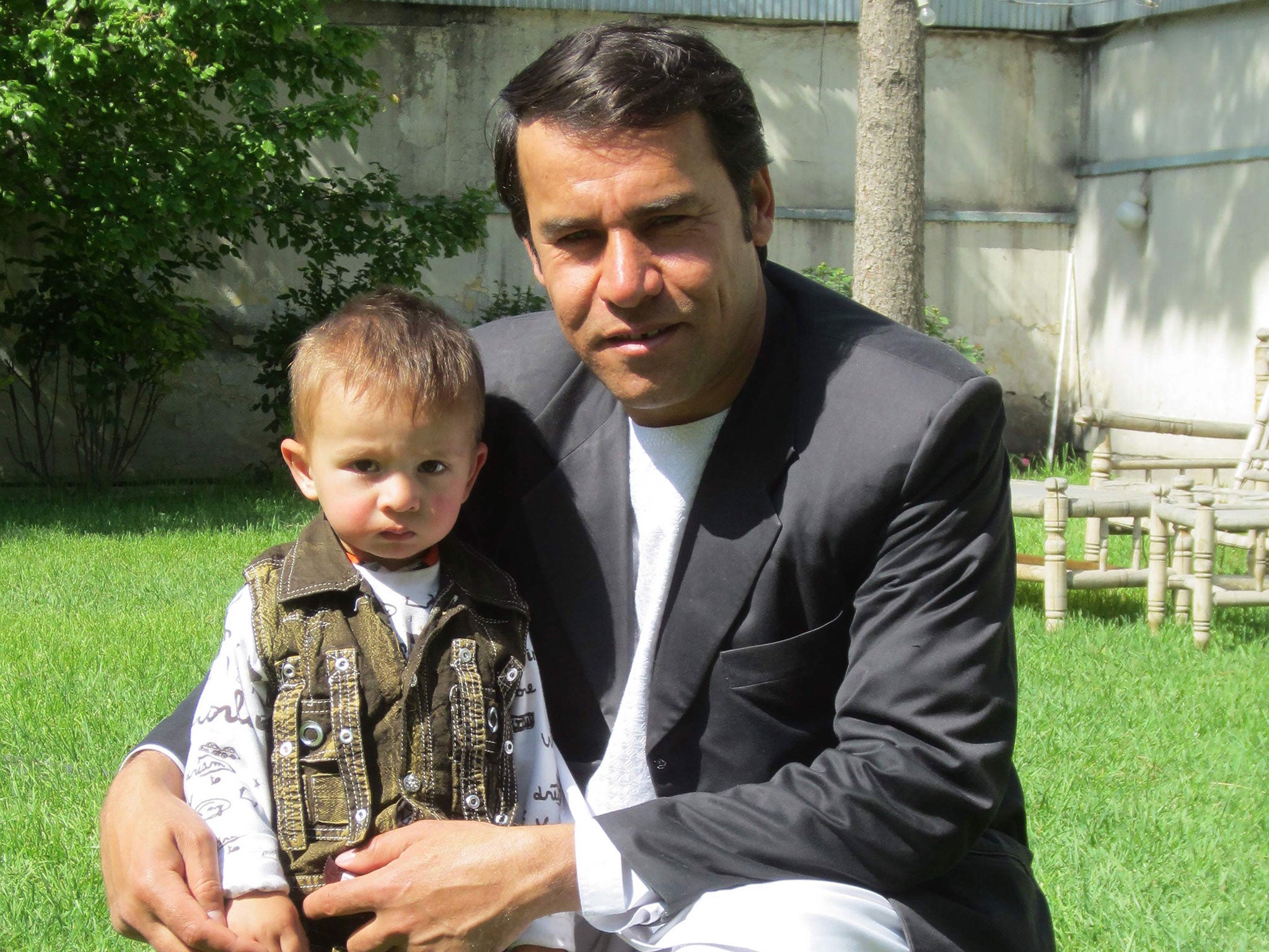 Shah Marai with one of his young sons in Kabul, 2013