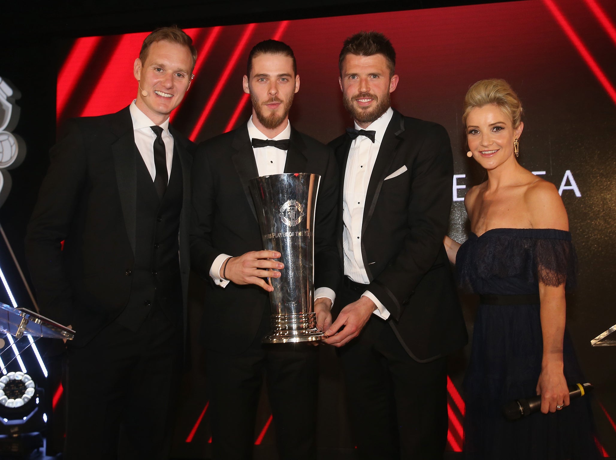 David de Gea collecting his trophy from team-mate Michael Carrick