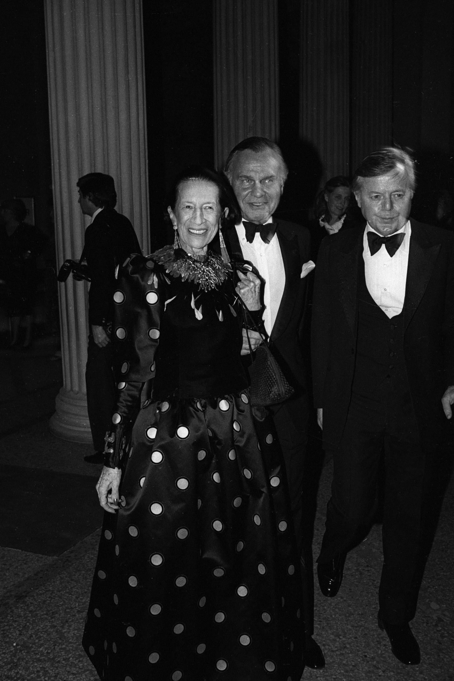 The legendary former Vogue editor attends the Met Gala in a black polka dot gown.