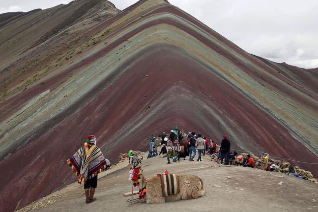 The mountain is formed of layers of multi-coloured sediment