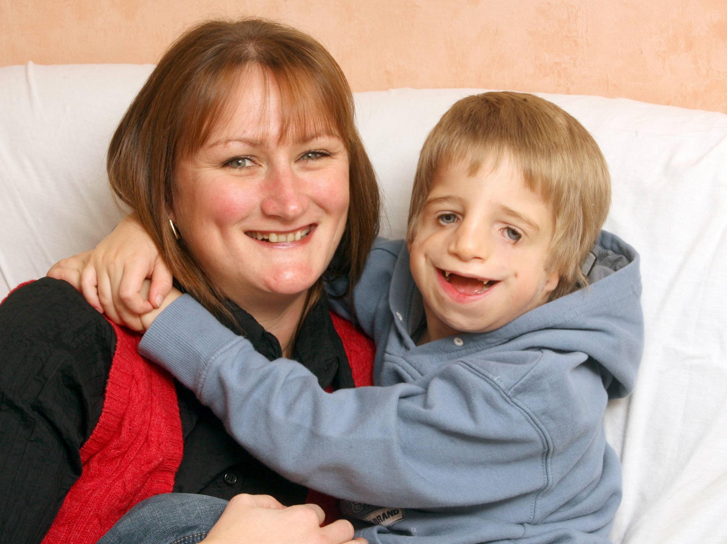 Ashley as a child with his mother, Louise