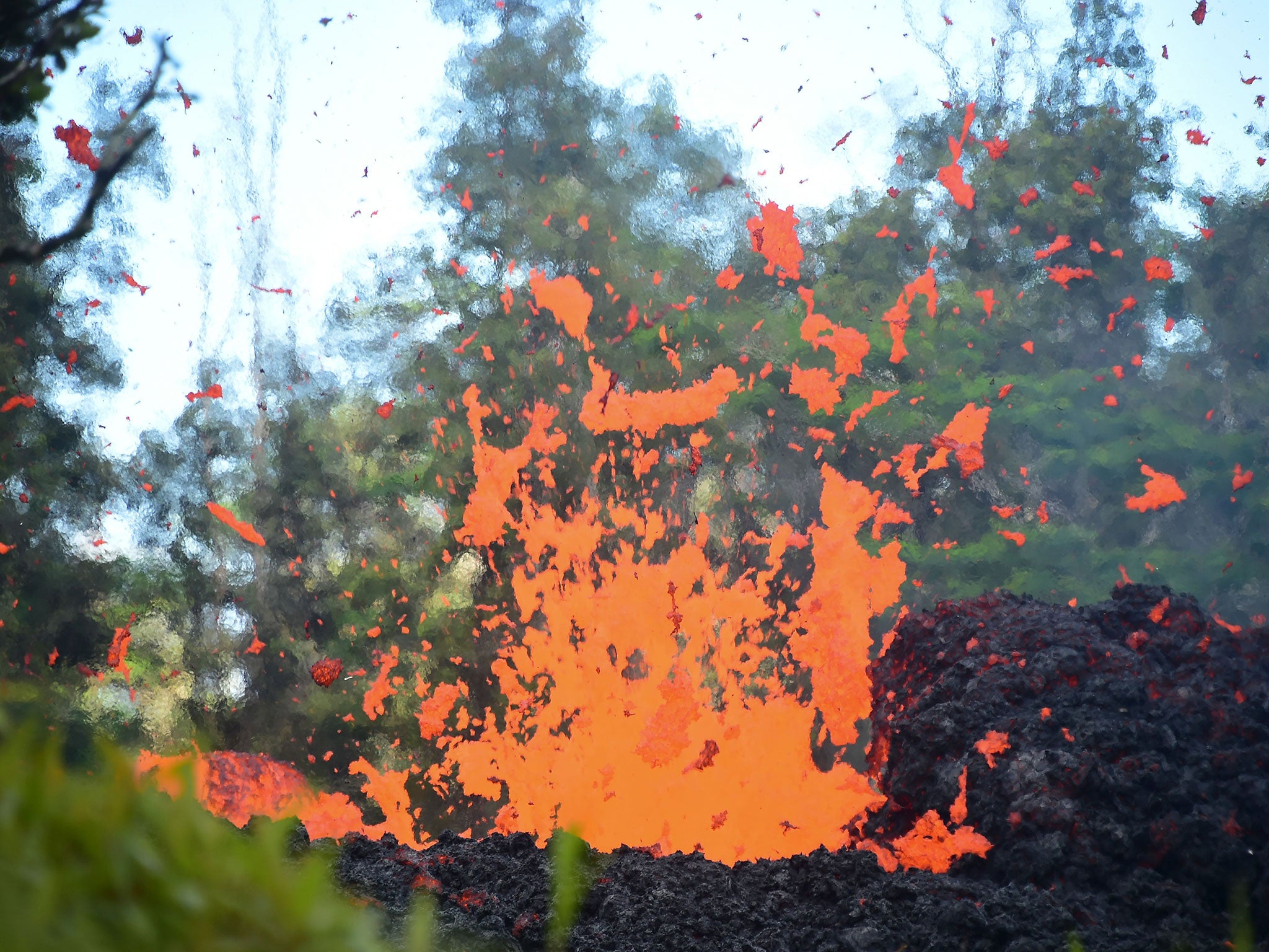 Lava is seen coming from a fissure in Leilani Estates subdivision on Hawaii’s Big Island